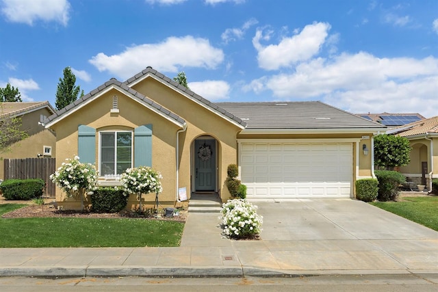 3415 Bellaire Ave, Clovis, CA 93619 - ranch-style house featuring an attached garage, concrete driveway, stucco siding, and a tile roof
