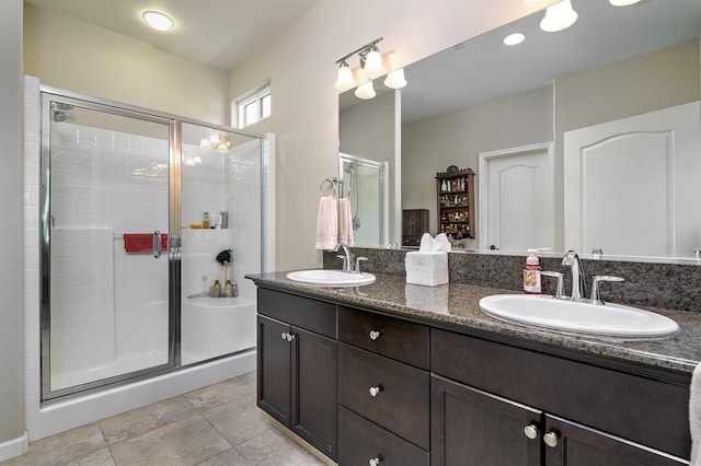 3415 Bellaire Ave, Clovis, CA 93619 - bathroom with a stall shower, tile patterned floors, and double vanity