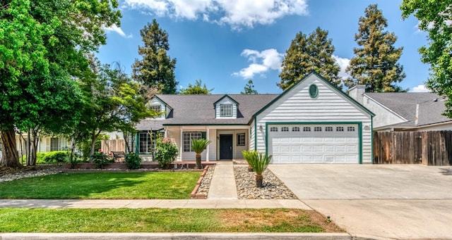 944 N Chapel Hill Ave, Clovis, CA 93611 - view of front facade with concrete driveway, a front lawn, an attached garage, and fence