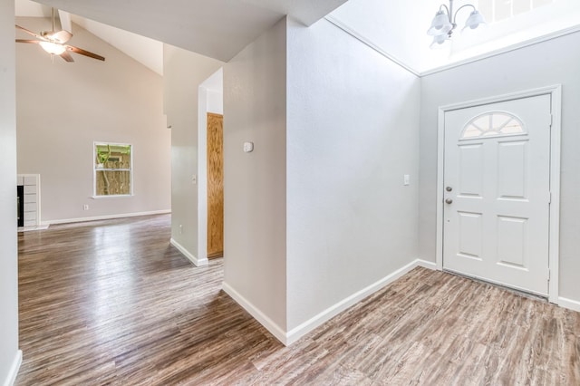 944 N Chapel Hill Ave, Clovis, CA 93611 - foyer featuring baseboards, wood finished floors, ceiling fan with notable chandelier, and high vaulted ceiling