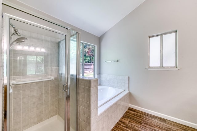 944 N Chapel Hill Ave, Clovis, CA 93611 - bathroom with wood finished floors, baseboards, vaulted ceiling, a shower stall, and a garden tub