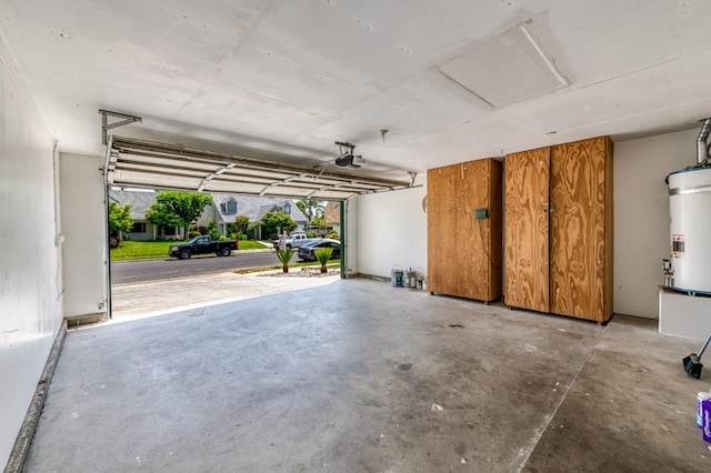 944 N Chapel Hill Ave, Clovis, CA 93611 - garage with secured water heater and a garage door opener