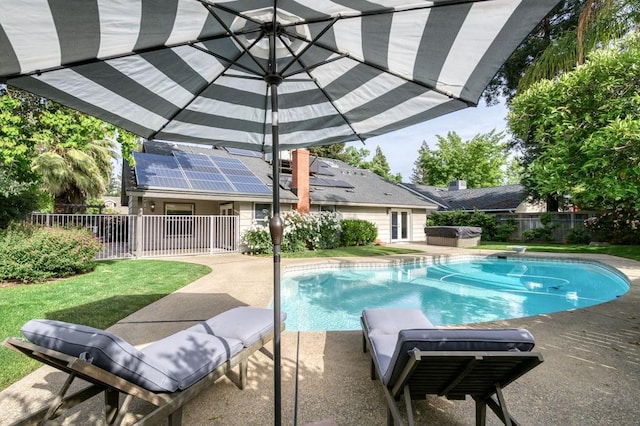 view of pool with a hot tub, a fenced backyard, a patio, and a fenced in pool