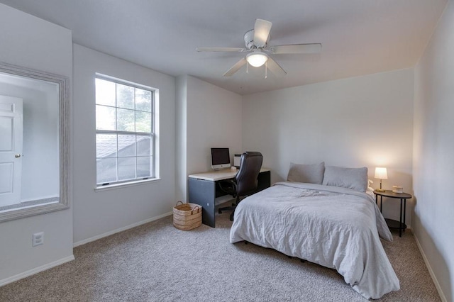 bedroom with baseboards, ceiling fan, and carpet floors