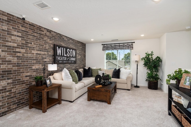 living area with visible vents, recessed lighting, light carpet, brick wall, and baseboards
