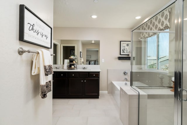 bathroom with tile patterned floors, a bath, a shower stall, vanity, and recessed lighting