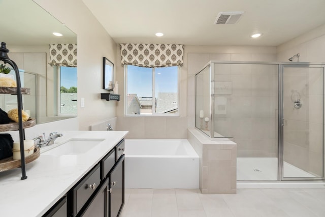 full bathroom with tile patterned flooring, a bath, a shower stall, and visible vents