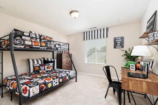 carpeted bedroom featuring visible vents and baseboards