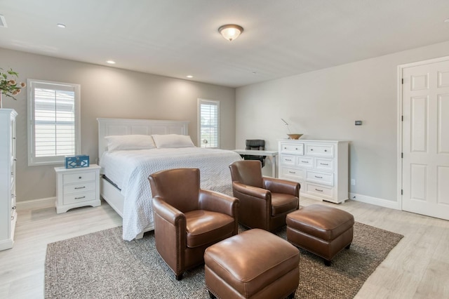 bedroom featuring recessed lighting, baseboards, and light wood-style floors