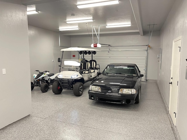 garage featuring a garage door opener
