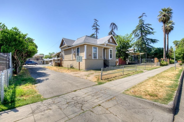 329 N Glenn Ave, Fresno, CA 93701 - view of side of home featuring fence private yard and aphalt driveway