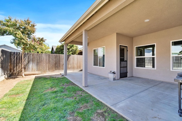view of yard featuring a patio area and a fenced backyard