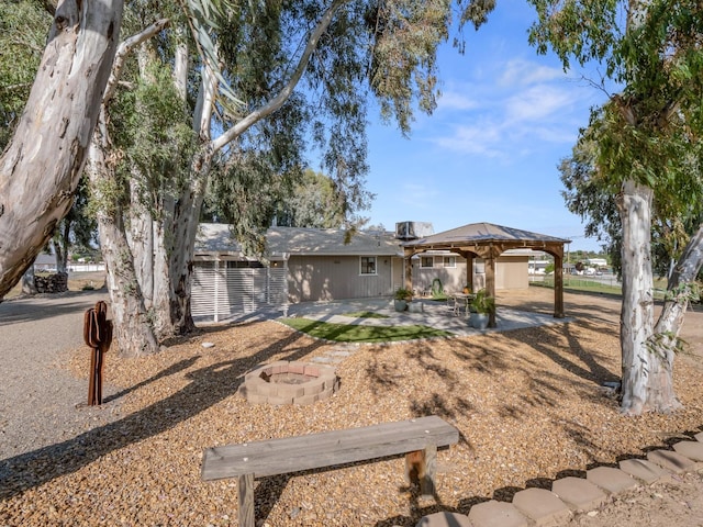 17324 Bonita Rd, Madera, CA 93636 - ranch-style house with an outdoor fire pit, a gazebo, a patio, and fence