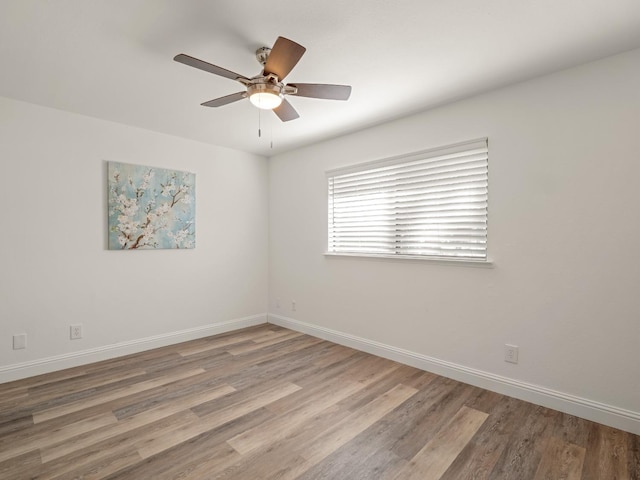 17324 Bonita Rd, Madera, CA 93636 - spare room featuring wood finished floors, baseboards, and ceiling fan