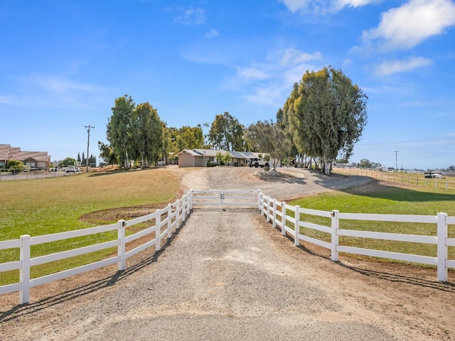 17324 Bonita Rd, Madera, CA 93636 - view of front of home featuring fence, dirt driveway, and a front yard