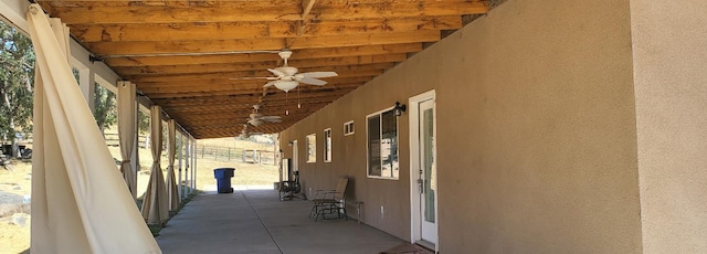 view of patio featuring ceiling fan