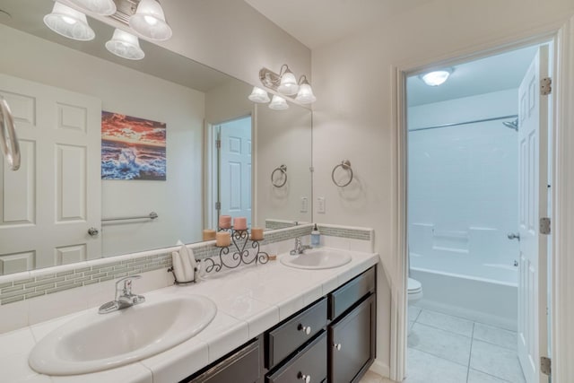 1525 N Piccadilly Ln, Clovis, CA 93619 - full bathroom featuring a sink, double vanity, toilet, and tile patterned floors