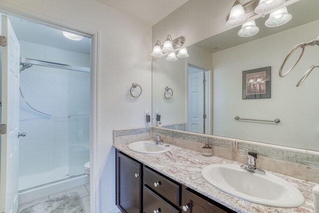 1525 N Piccadilly Ln, Clovis, CA 93619 - full bathroom with toilet, double vanity, a sink, and a shower stall