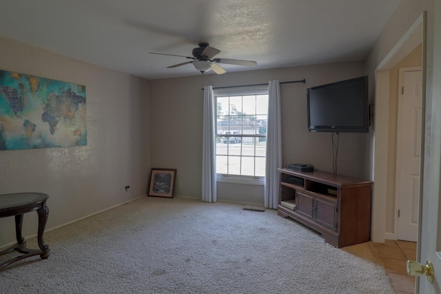 1233 Redwood Ln, Selma, CA 93662 - living area featuring a ceiling fan, light carpet, and baseboards