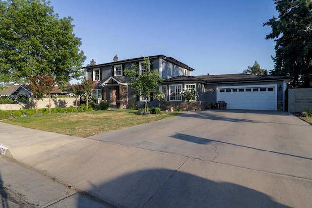 1233 Redwood Ln, Selma, CA 93662 - view of front of house with concrete driveway, a garage, and stone siding