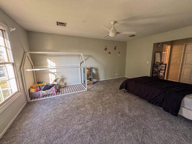 1233 Redwood Ln, Selma, CA 93662 - bedroom with multiple windows, carpet, baseboards, and a textured ceiling