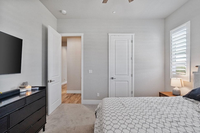 bedroom with carpet floors, baseboards, and ceiling fan