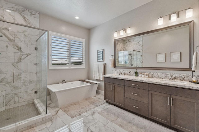 bathroom featuring marble look tile flooring, a stall shower, a freestanding bath, and double vanity
