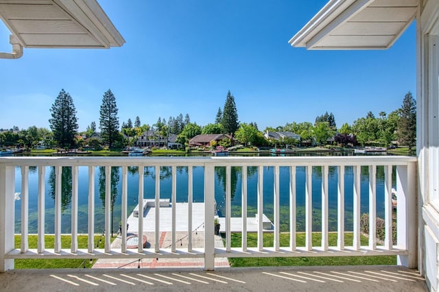 balcony featuring a water view