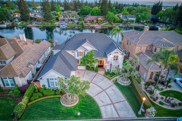 bird's eye view featuring a water view and a residential view