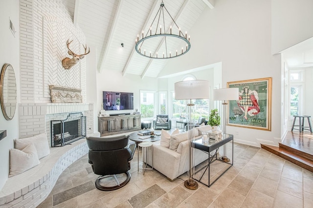 living room featuring beam ceiling, high vaulted ceiling, visible vents, a chandelier, and a brick fireplace