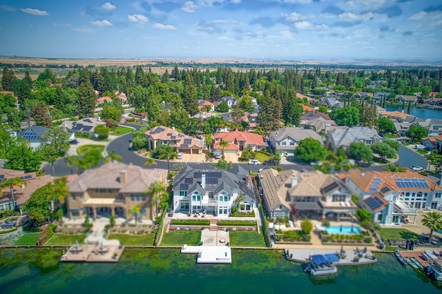 birds eye view of property featuring a water view and a residential view