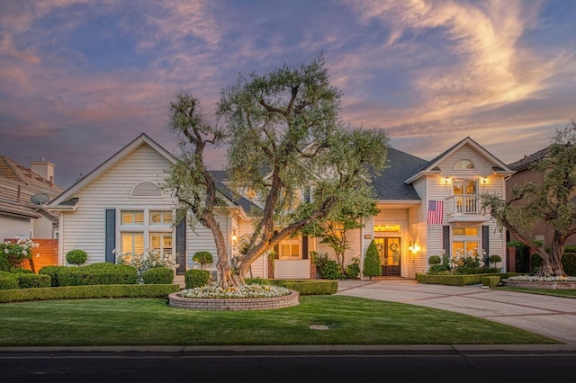 view of front of home with a front yard and driveway