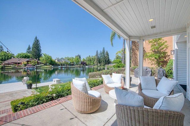 view of patio / terrace with an outdoor hangout area, a water view, and a grill