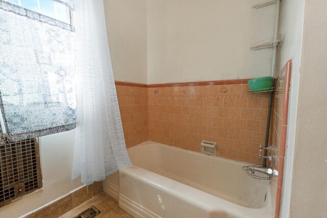4241 E Butler Ave, Fresno, CA 93702 - bathroom with shower / tub combo with curtain