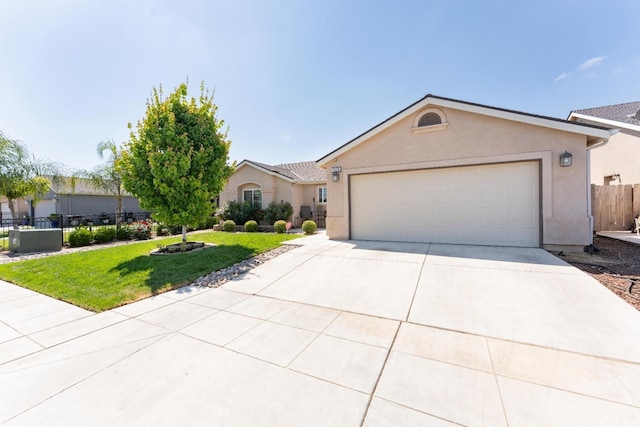 13375 Peach St, Parlier, CA 93648 - single story home featuring fence, an attached garage, driveway, stucco siding, and a front yard