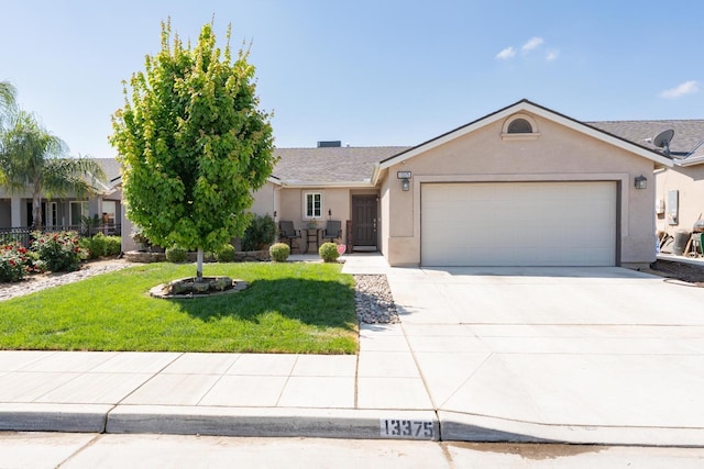 13375 Peach St, Parlier, CA 93648 - ranch-style house featuring a front yard, stucco siding, an attached garage, and driveway