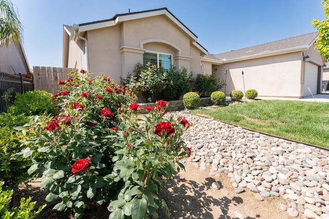 13375 Peach St, Parlier, CA 93648 - ranch-style house featuring an attached garage, stucco siding, and fence