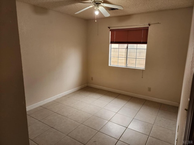 725 18th, Delano, CA 93212 - unfurnished room with light tile patterned floors, a textured ceiling, and a ceiling fan