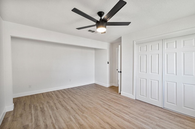 2194 N Feland, Fresno, CA 93722 - unfurnished bedroom featuring light wood-type flooring, baseboards, and a ceiling fan