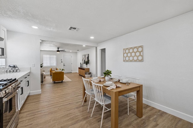 dining space featuring visible vents, recessed lighting, light wood finished floors, a ceiling fan, and baseboards