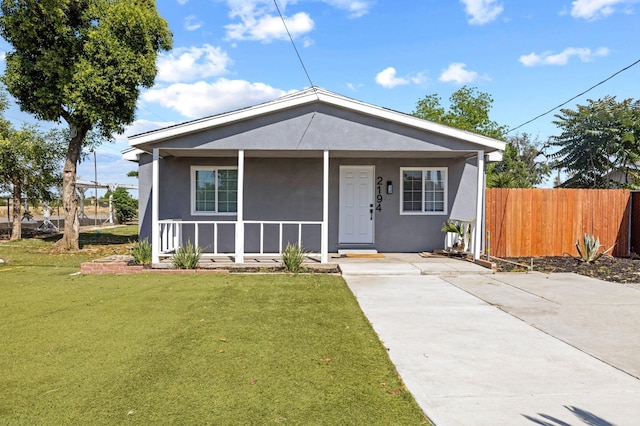 2194 N Feland, Fresno, CA 93722 - view of front facade featuring covered porch, stucco siding, and driveway