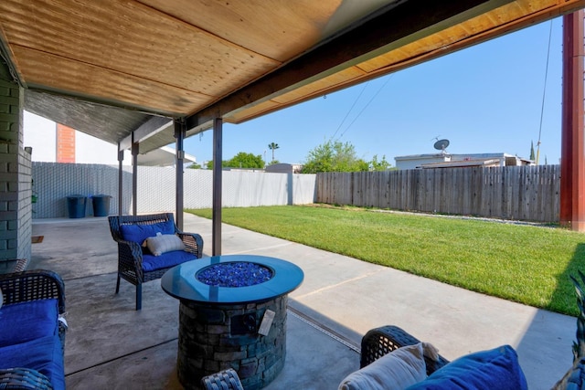 view of patio / terrace with an outdoor fire pit