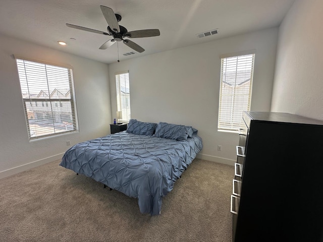 bedroom with baseboards, carpet, and ceiling fan