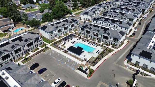 aerial view of residential area featuring a pool area