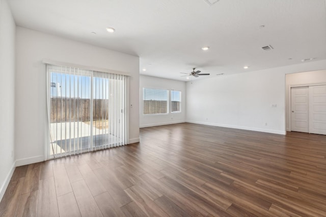 5091 N San Clemente Ave, Fresno, CA 93723 - empty room featuring a ceiling fan, recessed lighting, dark wood-style flooring, and baseboards
