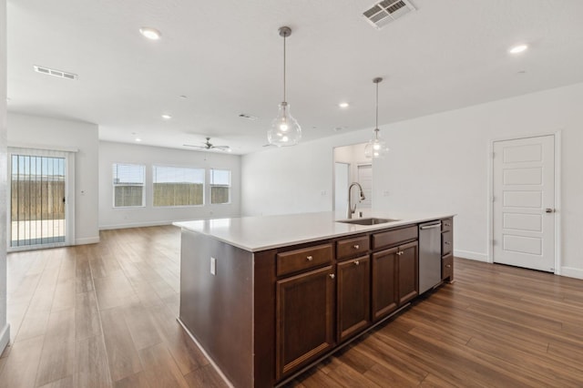 5091 N San Clemente Ave, Fresno, CA 93723 - kitchen featuring a sink, wood finished floors, stainless steel dishwasher, light countertops, and a ceiling fan