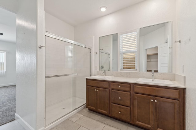 5091 N San Clemente Ave, Fresno, CA 93723 - full bath featuring a shower stall, double vanity, and tile patterned flooring