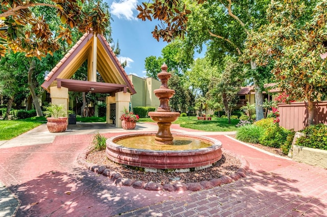 surrounding community featuring a gazebo and fence