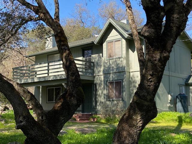 43777 Kaweah River Dr, Three Rivers, CA 93271 - view of front facade featuring a chimney and a balcony