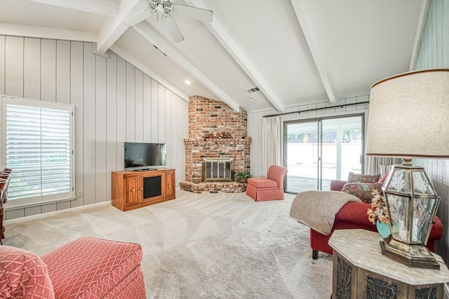 6619 N Valentine Ave, Fresno, CA 93711 - carpeted living area featuring a ceiling fan, a brick fireplace, and wood walls
